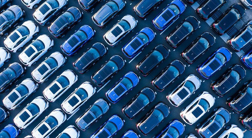 Aerial shots of many cars before sale.